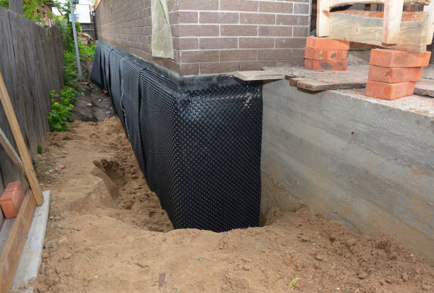 Happy homeowners after waterproofing job in New Lothrop